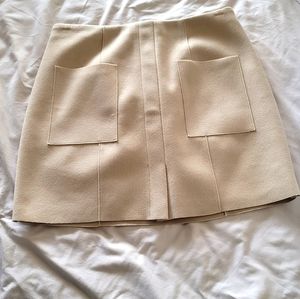 Patch pocket nude mini skirt